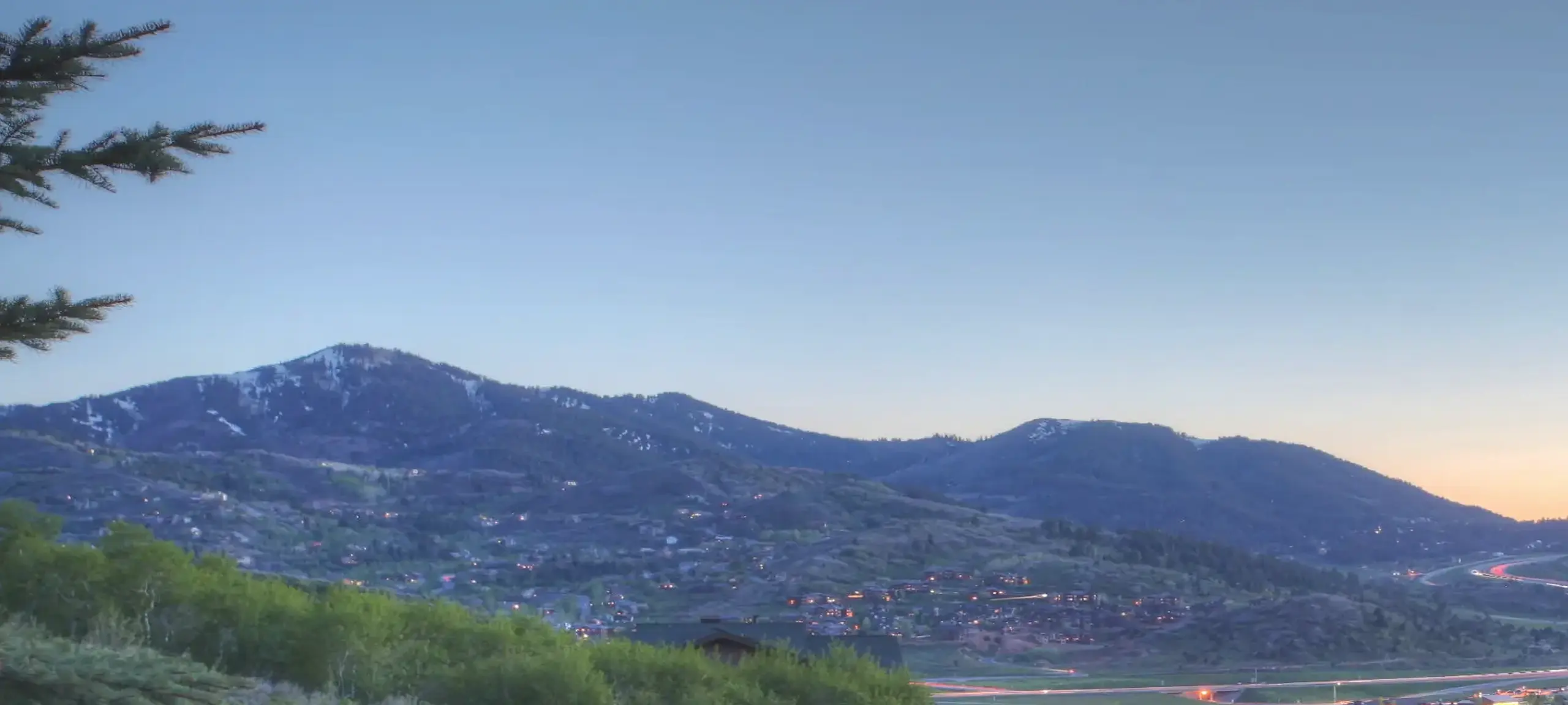 Homes on mountainside in Jeremy Ranch, Park City, during the evening